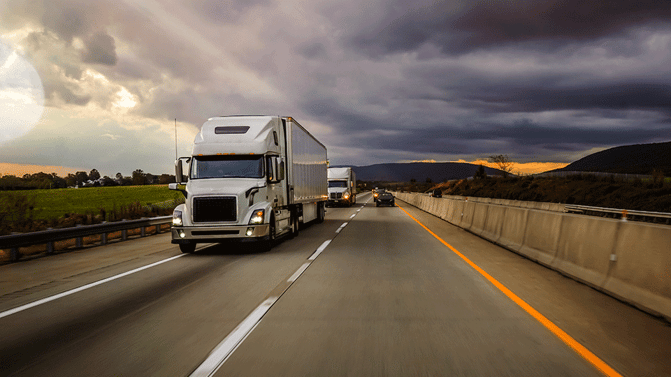 Two-semi-trucks-on-highway